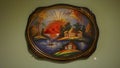 Mytishy district, RUSSIA - JULY, 2019: Zhostovo factory museum. Oval black metal tray with painting on the wall, old