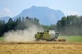 Combine harvester on grain field in the Salzkammergut Upper Austria, Austria