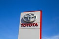 Close up of column with isolated logo of Toyota car manufacturer against blue sky