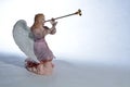 Angel playing Herald trumpet Royalty Free Stock Photo
