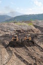 Gold mining industry.Bulldozers in the Siberian highlands extract natural gold