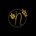 N Gold letter and Gold Leaf logo design. N Letter golden initial luxury Boutique Nature Floral Flower. N Monogram vector design