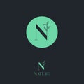 N letter. N monogram. Nature logo for cosmetic or organic food. Green letter with leaves.