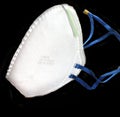 N95 mask in solid black background. Royalty Free Stock Photo