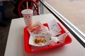 IN-N-OUT Burger - Hamburger and french fries after finished eating in a tray on the table inside the fast-food restaurant Royalty Free Stock Photo