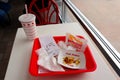 IN-N-OUT Burger - Hamburger and french fries after finished eating in a tray on the table inside the fast-food restaurant Royalty Free Stock Photo