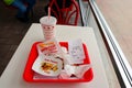 IN-N-OUT Burger - Hamburger and french fries after finished eating in a tray on the table inside the fast-food restaurant Royalty Free Stock Photo