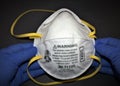 N95 Respirator face mask hold by both hands