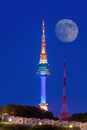 N Seoul Tower with full moon Located on Namsan Mountain in central Seoul,Korea. Royalty Free Stock Photo