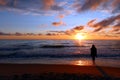 N unidentified woman watching the sunset. Scenic sunset over the sea Royalty Free Stock Photo
