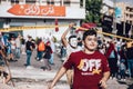 Boy wearing Guy Fawkes mask running in Lebanese Civil Protest