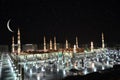 Nabawi Mosque in Medina and crescent at night time