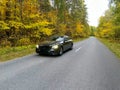 Naberezhnye Chelny, Russia - October 1, 2023: Mercedes-Benz E200 car stands on the road in the autumn forest