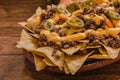 Nacho chips corn garnished with ground beef, melted cheese, jalapeÃÂ±o peppers, mexican spicy food in mexico Royalty Free Stock Photo