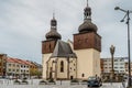 Nachod,Czech Republic- May 23,2021. City centre with Masaryk square,New Town Hall and medieval St. Lawrence`s Church with two bel