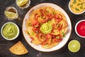 Nachos with beef, tequila shots, and various dips, Mexican food and drinks Royalty Free Stock Photo