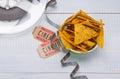 Nachos in a bucket, two tickets for movies and film, on a light gray background, close-up