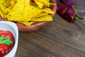 Nachos corn chips with classic tomato salsa. Fresh cold beer is perfect with savory snacks. Royalty Free Stock Photo