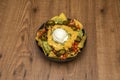 Nachos with guacamole and cheese are an easy dish to make,