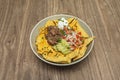 nachos with marinated beef, grilled pineapple, and morita chili salsa Royalty Free Stock Photo