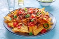 Nachos, Mexican food, tortilla chips with beef and fresh vegetables Royalty Free Stock Photo