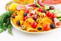 Nachos, olives, pork loin and vegetables Royalty Free Stock Photo