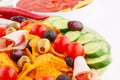 Nachos, olives, pork loin and vegetables Royalty Free Stock Photo