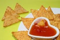 Nachos with salsa in a heart bowl