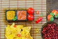 Nachos top view with Tortilla chips tomato salsa and mustard on rustic wooden background. A textured background.Copy paste place Royalty Free Stock Photo