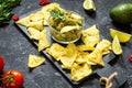 Nachos. Tortilla Chips with Guacamole on stone background Royalty Free Stock Photo