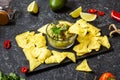 Nachos. Tortilla Chips with Guacamole on stone background Royalty Free Stock Photo