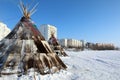 Dwellings of Nenets reindeer herders near city buildings in the city of Nadym in northern Siberia