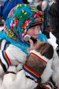 Portrait of a Siberian girl of Nenets nationality talking on the phone