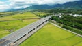 Aerial view of green rice field and train