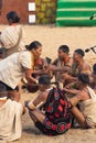 Naga men and women siting and performing a traditional tribal ritual