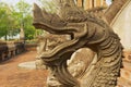 Naga sculpture at the stairs outside of the Hor Phra Keo buddhist temple and museum in Vientiane, Laos.