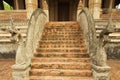 Naga sculptures at the stairs outside of the Hor Phra Keo buddhist temple and museum in Vientiane, Laos.