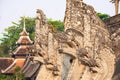 Naga serpent sculptures surrounding the main chedi at Wat Chedi Luang in Chiang Mai, Thailand