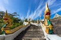 Naga snake on authentic staircase to Wat Kaew Korawaram white temple