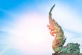 Naga statue spray water to the sea with blue sky background Royalty Free Stock Photo