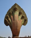 Naga stone statue in front of famous Angkor Wat temple complex,