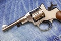 Nagan revolver on old blue jeans Royalty Free Stock Photo