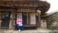 Nagan/South Korea-29.05.2018:The woman in traditional dress sitting inside the Naganeupseong folk village Royalty Free Stock Photo
