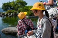 Nagasaki, Japan - May 18: Unidentified school girl with yellow hat smiles in Glover Garden on May 18, 2017 in Nagasaki