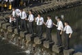 Students making fun and posing at step stones in the Nakashima River