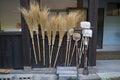 Traditional straw brooms to clean and maintain the temple grounds