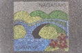 Asphalt illustration depicting the Meganebashi or Spectacles stone Bridge on the ground of Isahaya city. Royalty Free Stock Photo
