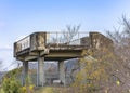 Close up on an observation deck overlooking the forest trees and plants of the Kazagashira park.