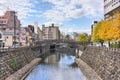 The higashi shimbashi stone bridge crossing the Nakashima river of Nagasaki in autumn. Royalty Free Stock Photo