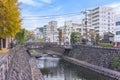 The Susukiwara stone bridge crossing the Nakashima river of Nagasaki in autumn. Royalty Free Stock Photo